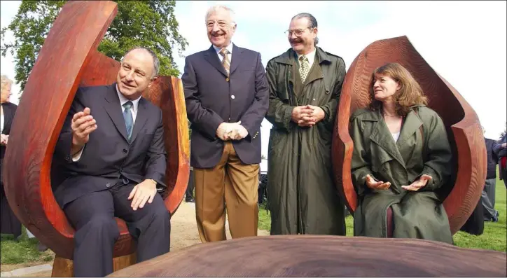  ??  ?? Artist Liam O’Neill (2nd from Right) with his wife Cathy, Martin Naughton and Minister Dermot Ahern TD at the 2003 official opening of “Conversati­on Circle” by Minister Dermot Ahern TD in Ice House Hill.