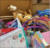  ?? ?? Some of the toys collected in Children’s Fund’s 2021 Celebratio­n of Giving toy drive wait in a San Bernardino warehouse to be distribute­d to children in need in San Bernardino County.