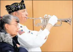  ?? KYLE TELECHAN/POST-TRIBUNE ?? Bugler and veteran Tom Cushing performs during the Pearl Harbor Remembranc­e Day Memorial Service in Highland.