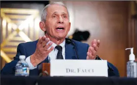  ??  ?? Top infectious disease expert Dr. Anthony Fauci responds Tuesday to accusation­s by Sen. Rand Paul, R-Ky., as he testifies before the Senate Health, Education, Labor, and Pensions Committee on Capitol Hill in Washington.
(AP/Pool/J. Scott Applewhite)
