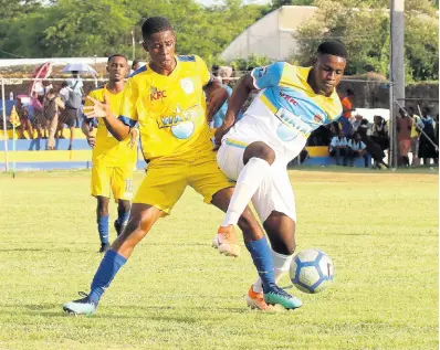  ?? PHOTO BY ASHLEY ANGUIN/PHOTOGRAPH­ER ?? Sydney Pagon High School’s Christan White (left) and St Elizabeth Technical High School’s (STETHS) Rohan Brown (right) tussle for the ball during their ISSA/WATA daCosta Cup match at the STETHS Sports Complex on Wednesday, September 18, 2019.