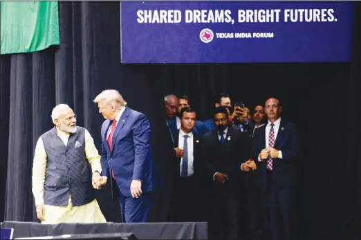  ??  ?? US President Donald Trump arrives to speak at the ‘Howdy Modi: Shared Dreams, Bright Futures’ event with Indian Prime Minister Narendra Modi at NRG Stadium on Sept 22 in
Houston. (AP) - WNR2 A, 24 cm
