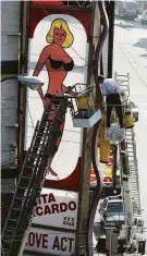  ?? Eric Luse / The Chronicle 1991 ?? The Condor Club sign in North Beach featuring Carol Doda and bright red nipples is taken down, Sept. 4, 1991.