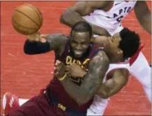  ?? FRED THORNHILL — THE CANADIAN PRESS VIA AP ?? Toronto’s Kyle Lowry fouls Cleveland’s LeBron James during the first half of Game 2 of their second-round series Thursday in Toronto.