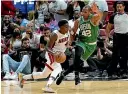  ?? AP ?? Boston Celtics centre Al Horford defends Miami Heat guard Victor Oladipo during the second game of the NBA Eastern Conference finals.