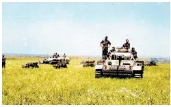  ?? ?? Pz.Kpfw.III motorcycle­s and an Sd.Kfz.251 armoured personnel carrier can be seen in field during the Kursk offensive in July 1943