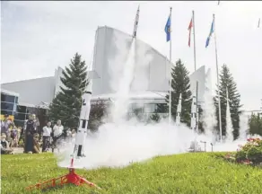 ?? Shaughn Butts ?? Model rockets launch Tuesday in front of the Telus World of Science to celebrate the 50th anniversar­y of the Apollo 11 mission.