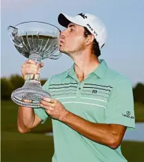  ?? — AFP ?? Long overdue win: Patrick Cantlay kissing his trophy after winning the Shriners Hospitals for Children Open at the TPC Summerlin in Las Vegas, Nevada, on Sunday.