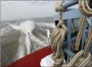  ?? GERALD HERBERT — THE ASSOCIATED PRESS ?? A wake is created Thursday during a media ride of the PT 305, which was restored by the National WWII Museum, on Lake Pontchartr­ain, where she was originally tested by Higgins Industries more than 70 years ago, in New Orleans. The U.S. Navy PT boat...