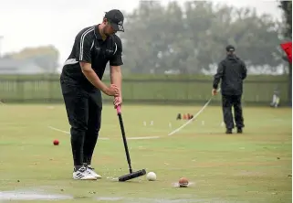  ?? MURRAY WILSON/ STUFF ?? Manawatu¯’s Andre Murray, competing in the wet at last year’s competitio­n, will be one of the players to watch at this year’s Rose Gardens Croquet Club tournament.