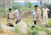  ?? PTI PHOTO ?? Police inspect the scene of crime with the accused, in Rohtak on Sunday.