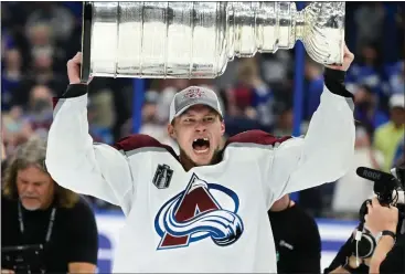  ?? ANDY CROSS — THE DENVER POST ?? Colorado Avalanche defenseman Erik Johnson (6) hoists the Stanley Cup after defeating the Tampa Bay Lighting winning the Stanley Cup at Amalie Arena June 26, 2022.