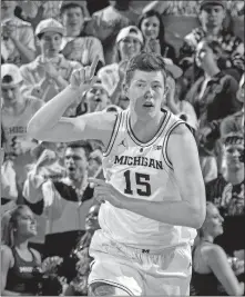  ?? [TONY DING/THE ASSOCIATED PRESS] ?? Michigan’s Jon Teske scored 17 points and had 11 rebounds in the Wolverines’ win over Northweste­rn on Sunday.