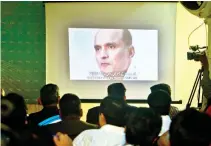  ??  ?? Journalist­s look a image of Kulbhushan Jadhav during a press conference by Pakistan’s army spokesman and the Informatio­n Minister, in Islamabad, in this March 29, 2016 file photo. (AP)