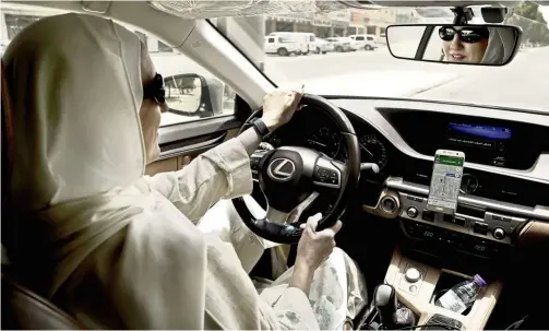  ??  ?? Ammal has signed up to be a driver for Careem, a regional ride-hailing service that is a competitor to Uber – it’s the latest job opening for Saudi women. — Photos: AP