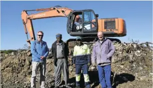  ??  ?? KINGS OF THE DUMP: Assisting the municipali­ty to clear the Port Alfred landfill site were, from left, Marius Els of Mphele Engineers, who are consulting on the project, Kandley Nginase, Richman Ngesi and Viv Dell who have used their skills and...