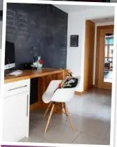  ??  ?? HOME OFFICE The corridor that links the old and new parts of the house is the Millers’ discreet home office. Adjacent to the front door and hall, the blackboard wall is perfectly placed for everyone to leave notes.