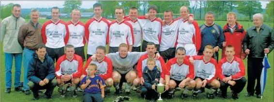  ?? (Pic: The Avondhu Archives) ?? DOUBLE CELEBRATIO­NS - Cappoquin FC, winners of the Liam Fitzgerald Cup in 2002, after beating Valley Rangers 1-0 in the final, played in Lismore. The club also secured the Premier League title the same season.
