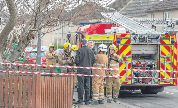  ?? Picture: Steven Brown. ?? Emergency services workers at the scene of the fatal fire in Leven.