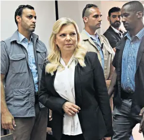  ??  ?? Sara Netanyahu, who admitted to using state funds for personal meals and, right, her husband Benjamin, unveiling a constructi­on project named in honour of Donald Trump in the Golan Heights yesterday