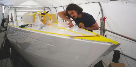  ??  ?? Above: George Maisey fits the new foredeck cleats after the paint job. Left: Harry installs new cabin windows. The old Perspex windows were replaced with polycarbon­ate