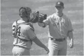  ?? ALEX BRANDON/AP ?? The Yankees picked up a two-year, $27 million option on left-handed reliever Zack Britton, right.