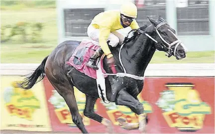  ?? (Photos: Joseph Wellington) ?? Trevor’s Choice with Oshane Nugent gallops home a winner of the Christophe­r Armond Sprint Trophy over 1100 metres at Caymanas Park yesterday.