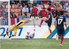  ?? — AFP ?? Canada’s goalkeeper Milan Borjan (L) makes a save during a Group A match against Costa Rica in the 2017 Concacaf Gold Cup in Houston, Texas.