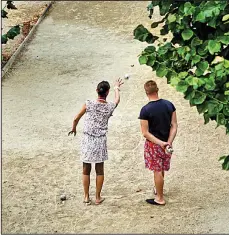  ?? Rick Steves’ Europe/DOMINIC ARIZONA BONUCCELLI ?? Admire the skill of ball-tossing boules players in village squares — or join a game for maximumum joie de vivre.