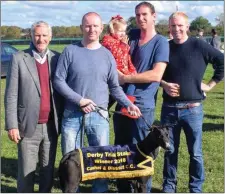  ??  ?? Vincent, Carroll, Nell, Ger and Uinsean Purtill from Ballybunio­n with their dog Ballinveal­a Toru after winning the Cashel Derby Trial Stake.