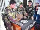  ?? TED ALJIBE/AFP ?? Philippine Army troopers display an Islamic State flag and 11kg of the illegal drug ‘shabu’, which were recovered from an Islamist militants’ position in Marawi, on the southern island of Mindanao, on June 19.