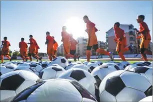  ??  ?? China’s new youth soccer blueprint recommends a developmen­t model that is divided into five categories — skills, tactics, body strength, mentality and social skills.