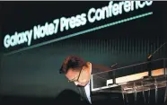  ??  ?? Koh Dong-jin, president of Samsung Electronic­s’ mobile communicat­ions business, bows during a news conference in Seoul on Monday.