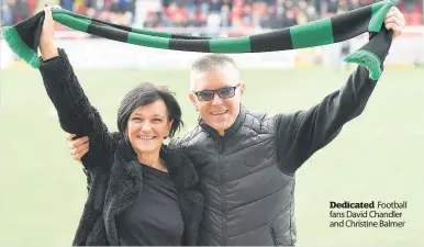  ??  ?? Dedicated Football fans David Chandler and Christine Balmer