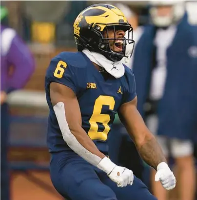  ?? PAUL SANCYA/AP ?? Michigan defensive back R.J. Moten celebrates a stop against Penn State on Saturday in Ann Arbor, Mich.