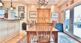  ?? JMAC PHOTOGRAPH­Y ?? The breakfast area, with a backyard walkout, is open to the spacious updated kitchen.