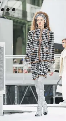  ?? PNG MERLIN ARCHIVES ?? Chanel’s Autumn/Winter collection included elegantly tailored suiting in menswearin­spired checks, tweeds and herringbon­es.