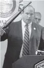  ?? Bob Eighmie ?? Fort Lauderdale Police Captain Paul Kiley holds up an AR-15 firearm in 2004. Kiley is now the director of the Miami Dade College School of Justice.