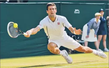  ?? Carl Court Agence France-presse/getty Images ?? NOVAK DJOKOVIC’S five-set win over Juan Martin del Potro lasted 4 hours 43 minutes, longest semifinal in Wimbledon history. His opponent in Sunday’s final, Andy Murray, could be Britain’s first champion since 1936.