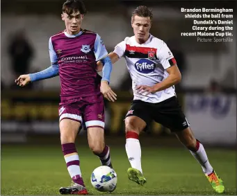  ?? Picture: Sportsfile ?? Brandon Bermingham shields the ball from Dundalk’s Daniel Cleary during the recent Malone Cup tie.