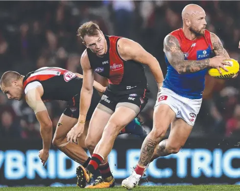  ?? Picture: GETTY IMAGES ?? SEE YA: Nathan Jones of the Demons breaks free of a tackle during the round 6 AFL match against the Bombers.