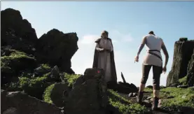  ?? Photos courtesy of Disney Lucasfilm ?? ( Left) Mark Hamill and Daisy Ridley shoot a scene on Skellig Michael and ( below) the actors discuss the shoot.