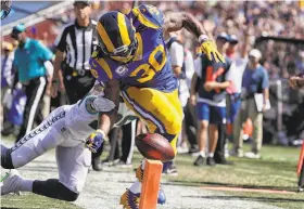  ?? Robert Gauthier / Los Angeles Times ?? Seattle’s Earl Thomas strips Todd Gurley at the goal line for a firstquart­er fumble, one of two big plays the safety made that helped the Seahawks to victory.