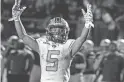  ?? ALEX GOULD/SPECIAL TO THE REPUBLIC ?? Cactus junior running back Damian Jiles celebrates a touchdown against Peoria at Peoria.