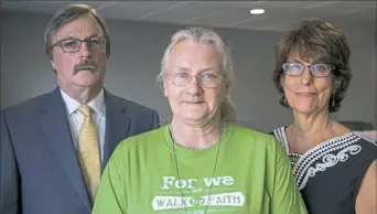  ?? Alex Driehaus/Post-Gazette ?? Susan Donohue of West Deer, center, with her lawyers, Timothy O'Brien and Tybe Ann Brett.