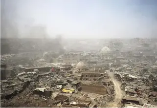  ?? AFPPIX ?? ... A picture taken on Sunday shows a general view of the destructio­n in Mosul’s Old City. Iraq’s Prime Minister Haider al-Abadi visited the city on Sunday, hailing his forces for securing ‘victory’ over Islamic State, their biggest yet against the...