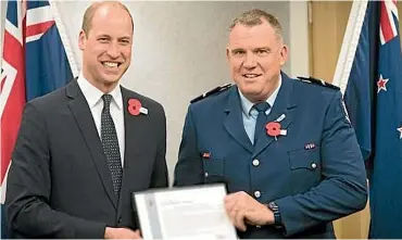  ??  ?? Senior Constable Jim Manning, pictured with the Duke of Cambridge Prince William, arrested the Christchur­ch mosque shootings terrorist alongside his colleague Scott Carmody.