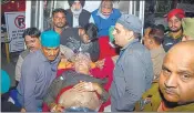  ?? SAMEER SEHGAL/HT ?? ExAAP Amritsar city president Suresh Sharma being shifted to a hospital in Amritsar.