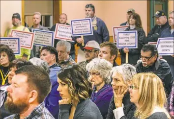  ?? Andrew Rush/Post-Gazette ?? Opponents and supporters of the Shell petrochemi­cal and ethane cracker plant listen during a meeting of Potter Township supervisor­s Wednesday night.