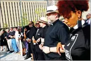  ?? AP PHOTO BY CHRISTIAN GOODEN ?? Clergy pray together during in an interfaith prayer service calling for peace and solidarity at Kiener Plaza on Tuesday, in St. Louis.